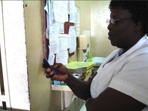 Nurse_in_Ghana_using_mobile_phone