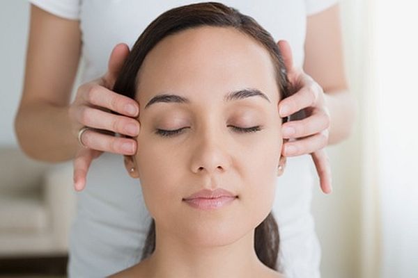 Woman having head massage