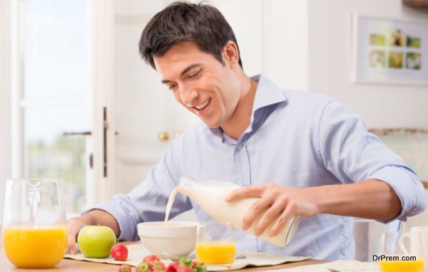 Man Having Breakfast With Milk