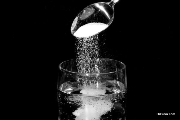 Pouring Salt In Glass of Water