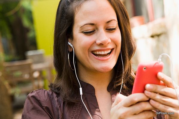 Woman listening to music on a mobile phone
