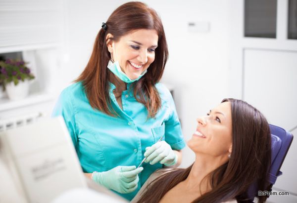 Young woman patient and dentist