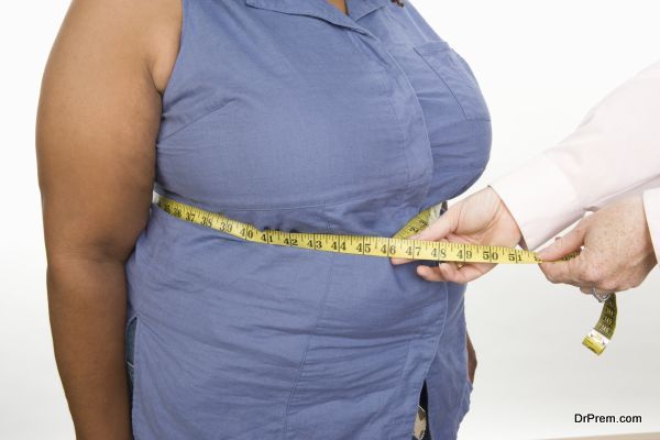 Doctor taking measures of overweight mid-adult woman