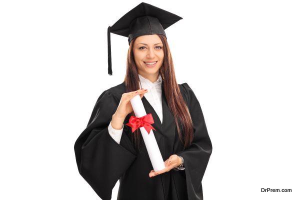 Female graduate student holding a diploma