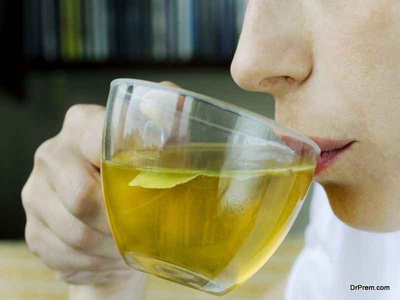 Woman sipping green tea 