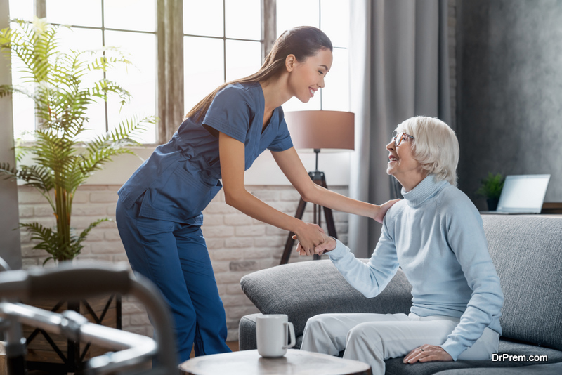 care worker taking care of old woman