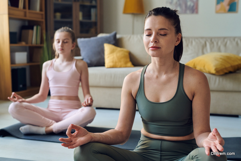 mother and daughter practicing meditation