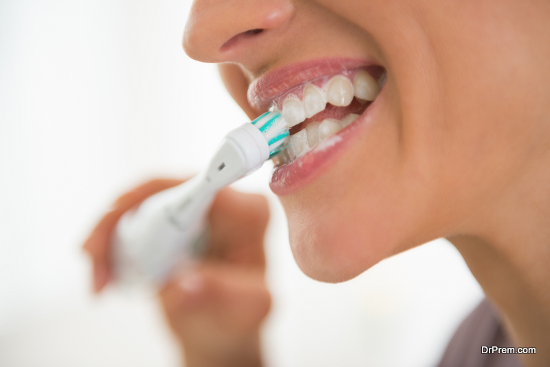 woman brushing teeth