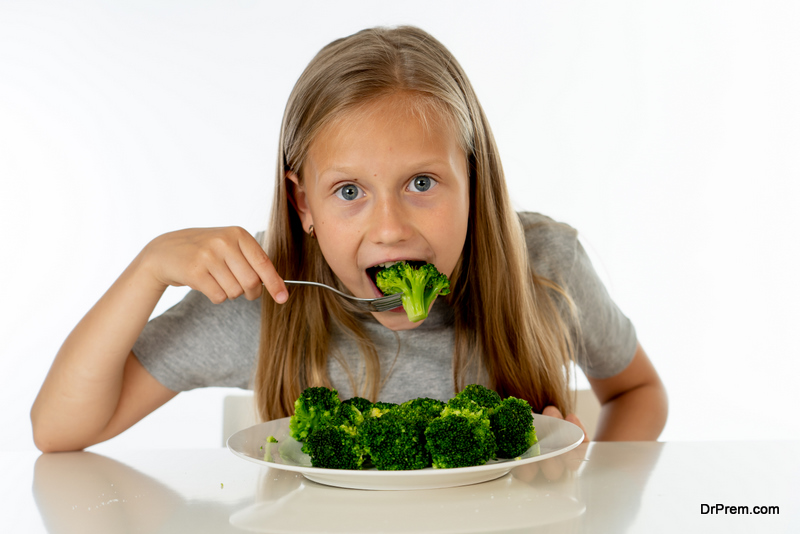 girl eating Broccoli