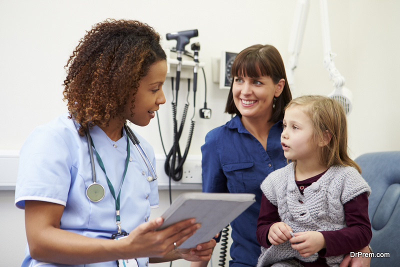 woman with child consulting nurse