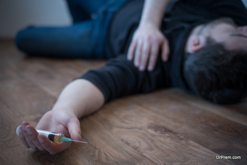 Man lying down on the floor after a drug overdose